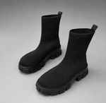 Women's waterproof stretch ankle boots with a flexible synthetic upper, warm faux fur lining, lace-up detailing, slip-on design and non-slip rubber sole for comfortable everyday autumn and winter wear.