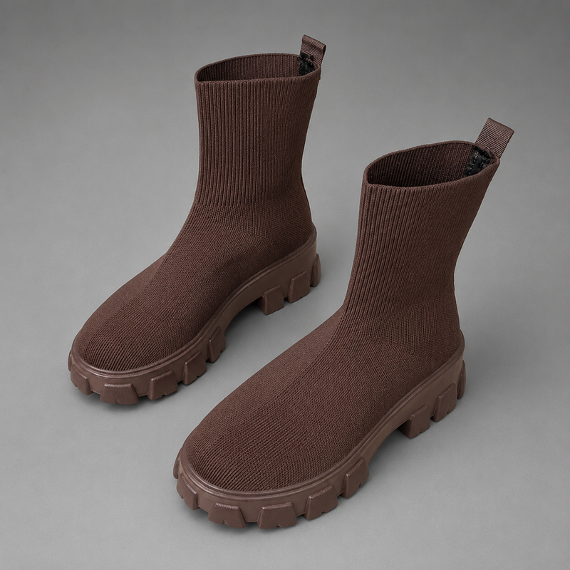 Women's waterproof stretch ankle boots with a flexible synthetic upper, warm faux fur lining, lace-up detailing, slip-on design and non-slip rubber sole for comfortable everyday autumn and winter wear.