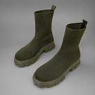 Women's waterproof stretch ankle boots with a flexible synthetic upper, warm faux fur lining, lace-up detailing, slip-on design and non-slip rubber sole for comfortable everyday autumn and winter wear.