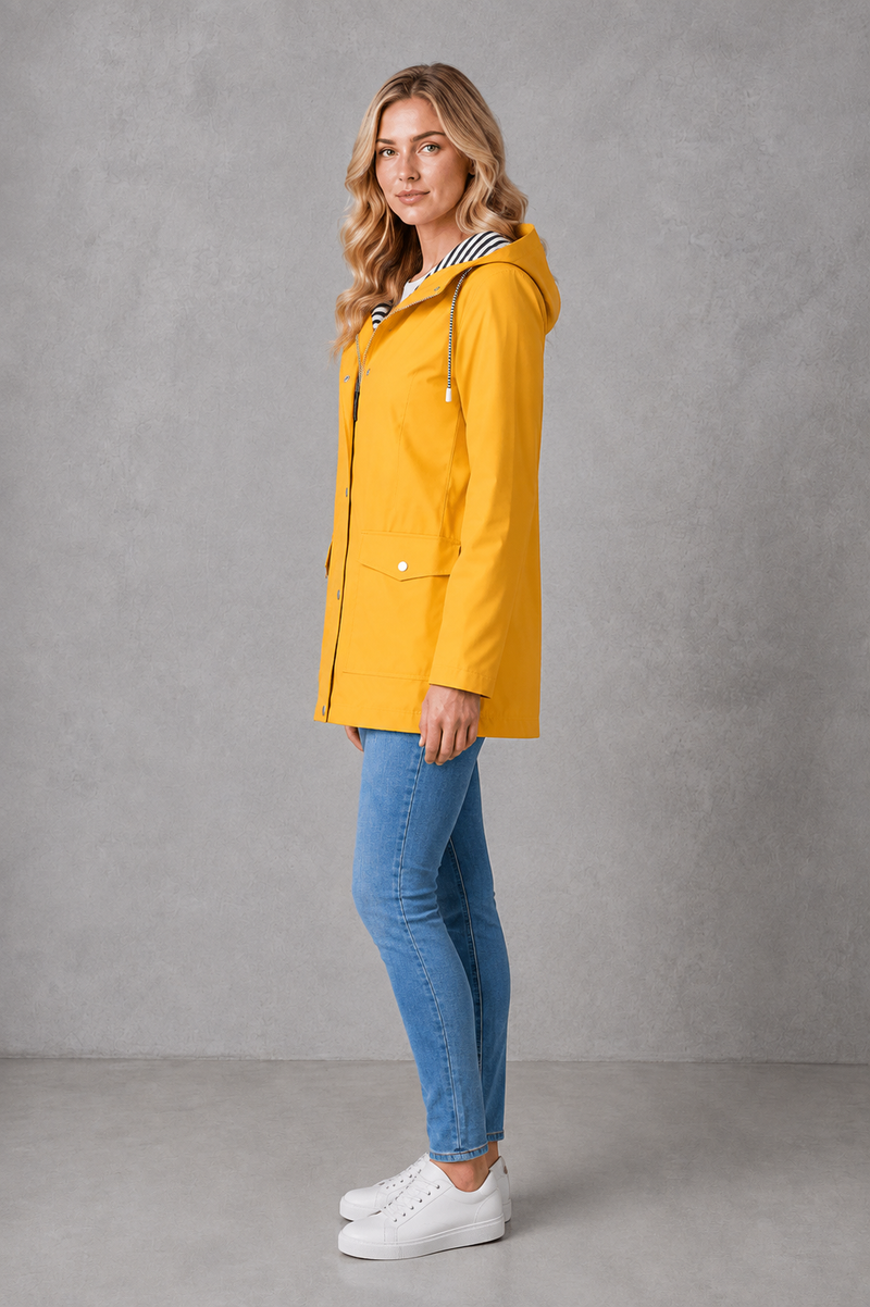 Women's waterproof and windproof hooded coat in a lightweight longline design with adjustable hood, weather-resistant fabric and a flattering regular fit, ideal for everyday wear, commuting and rainy British weather.