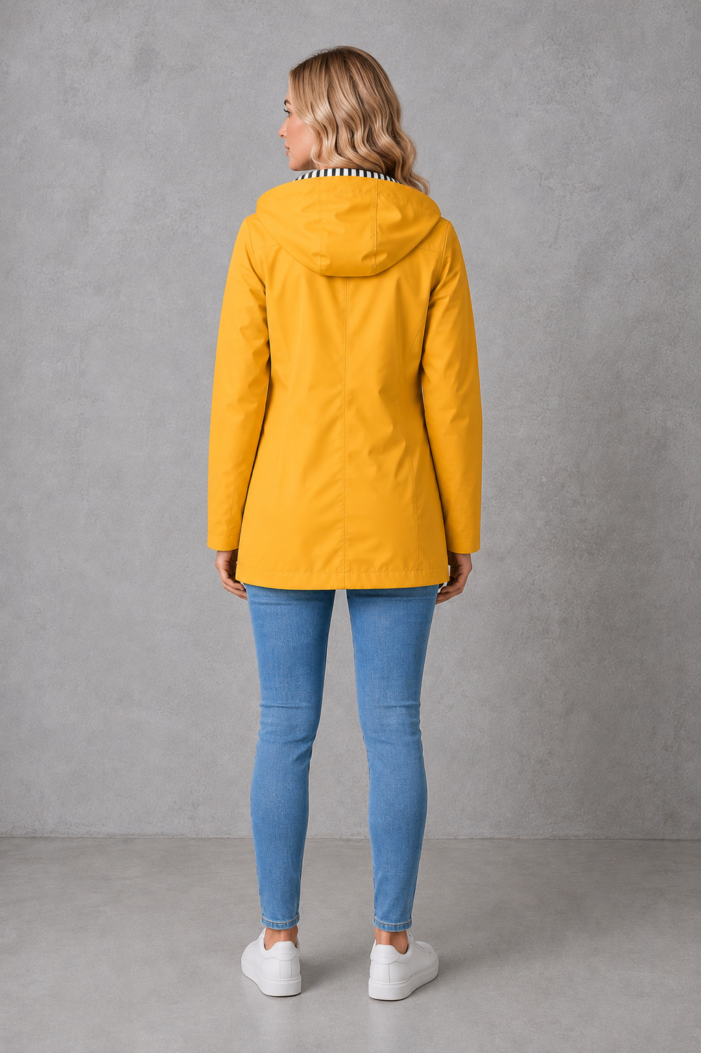 Women's waterproof and windproof hooded coat in a lightweight longline design with adjustable hood, weather-resistant fabric and a flattering regular fit, ideal for everyday wear, commuting and rainy British weather.