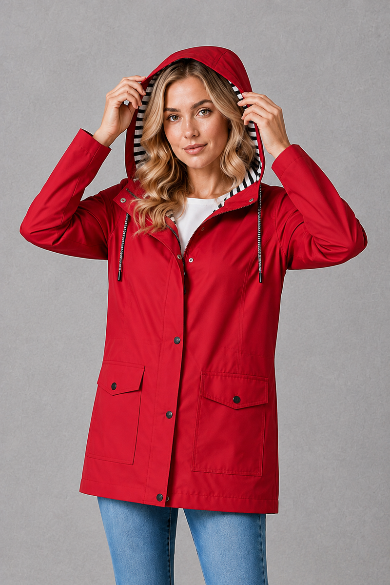 Women's waterproof and windproof hooded coat in a lightweight longline design with adjustable hood, weather-resistant fabric and a flattering regular fit, ideal for everyday wear, commuting and rainy British weather.