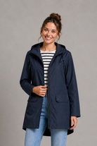 Women's waterproof and windproof hooded coat in a lightweight regular fit, featuring an adjustable hood and flattering silhouette. Ideal for autumn and winter, this weather-resistant rain jacket offers reliable protection for commuting, countryside walks and everyday wear.