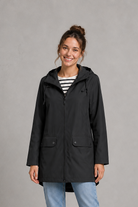 Women's waterproof and windproof hooded coat in a lightweight regular fit, featuring an adjustable hood and flattering silhouette. Ideal for autumn and winter, this weather-resistant rain jacket offers reliable protection for commuting, countryside walks and everyday wear.