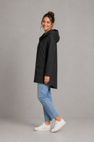 Women's waterproof and windproof hooded coat in a lightweight regular fit, featuring an adjustable hood and flattering silhouette. Ideal for autumn and winter, this weather-resistant rain jacket offers reliable protection for commuting, countryside walks and everyday wear.