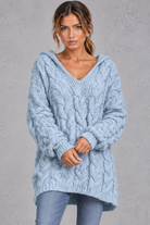 Women's light blue chunky cable knit hooded jumper with V-neck – front view