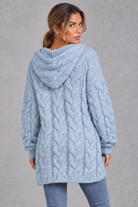 Women's light blue chunky cable knit hooded jumper – back view showing hood
