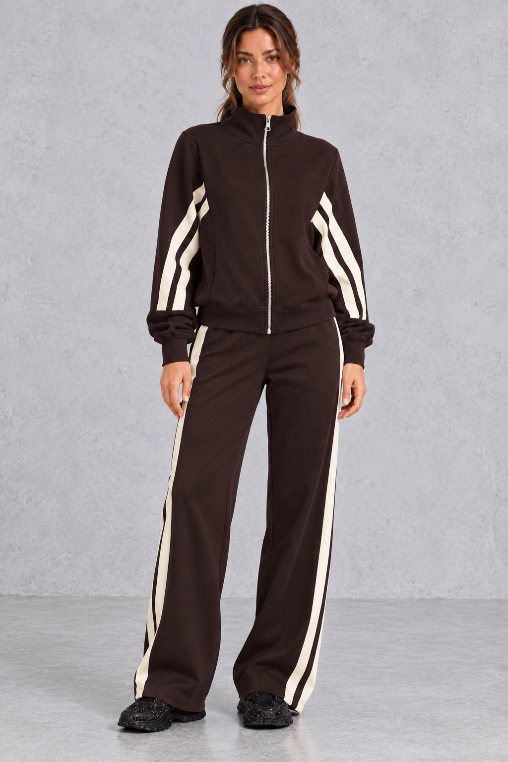 Women's brown zip-up tracksuit set with cream side stripes – front view