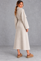 Women's belted wrap coat in Oatmeal – back view