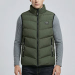 Person wearing a green puffer vest over a gray shirt on a light gray background