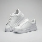 Pair of white sneakers on a gray background1