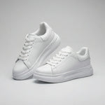 Pair of white sneakers on a gray background1
