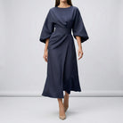 Navy blue dress with a belt on a plain background