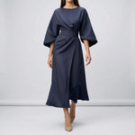 Navy blue dress with a belt on a plain background