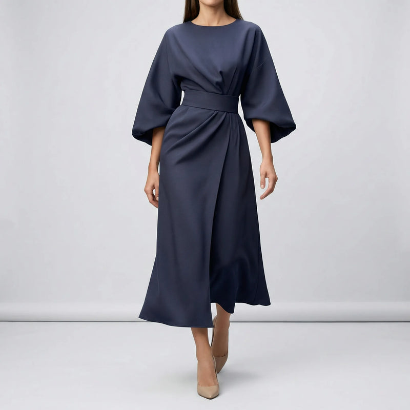 Navy blue dress with a belt on a plain background