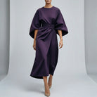 Purple dress with wide sleeves on a plain background1