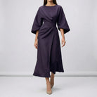 Black dress with wide sleeves on a plain background3
