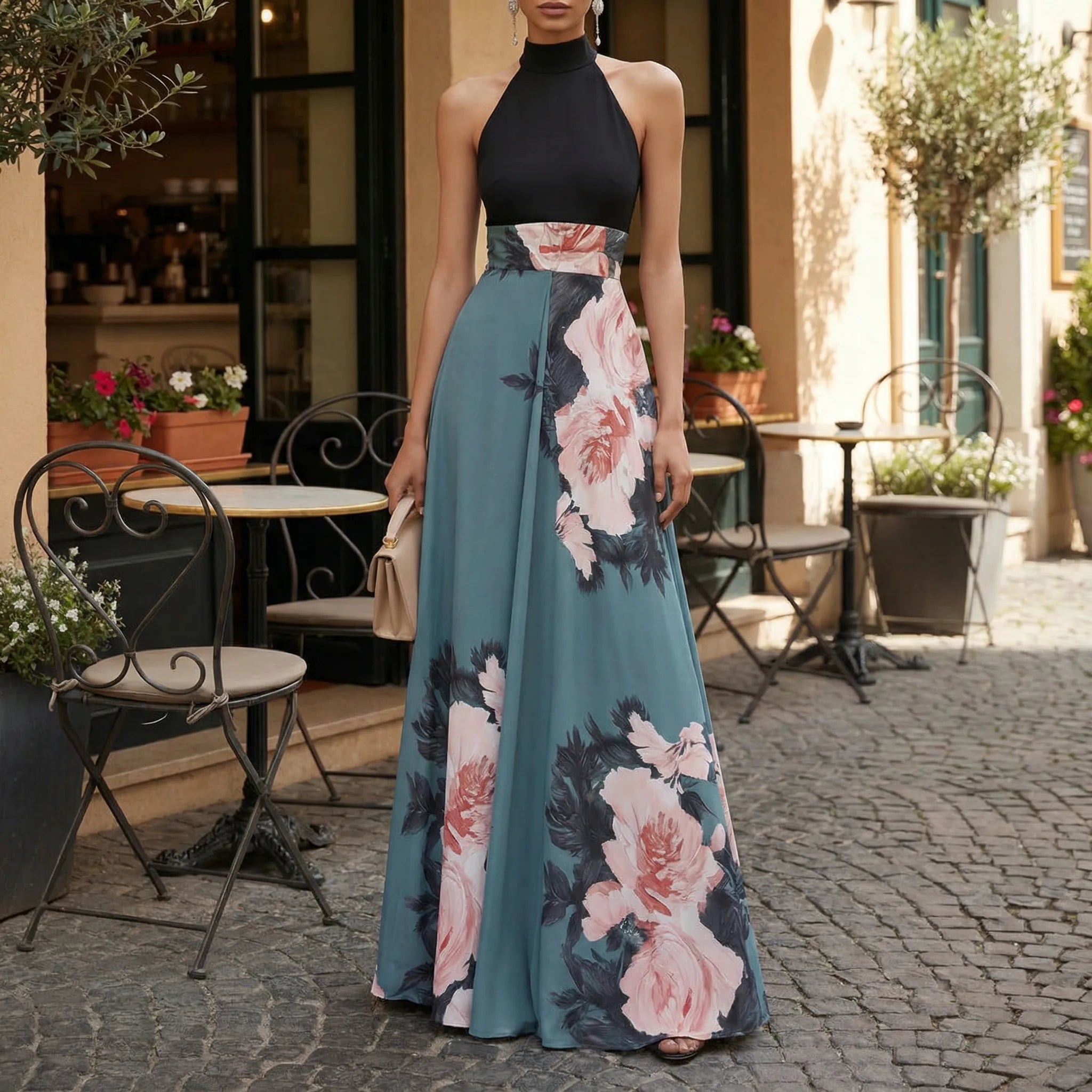 Woman wearing a floral dress standing on a street with outdoor seating in the background