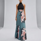 Woman wearing a black top and floral dress on a gray background1