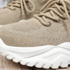 Close-up of a beige sneaker with white sole2