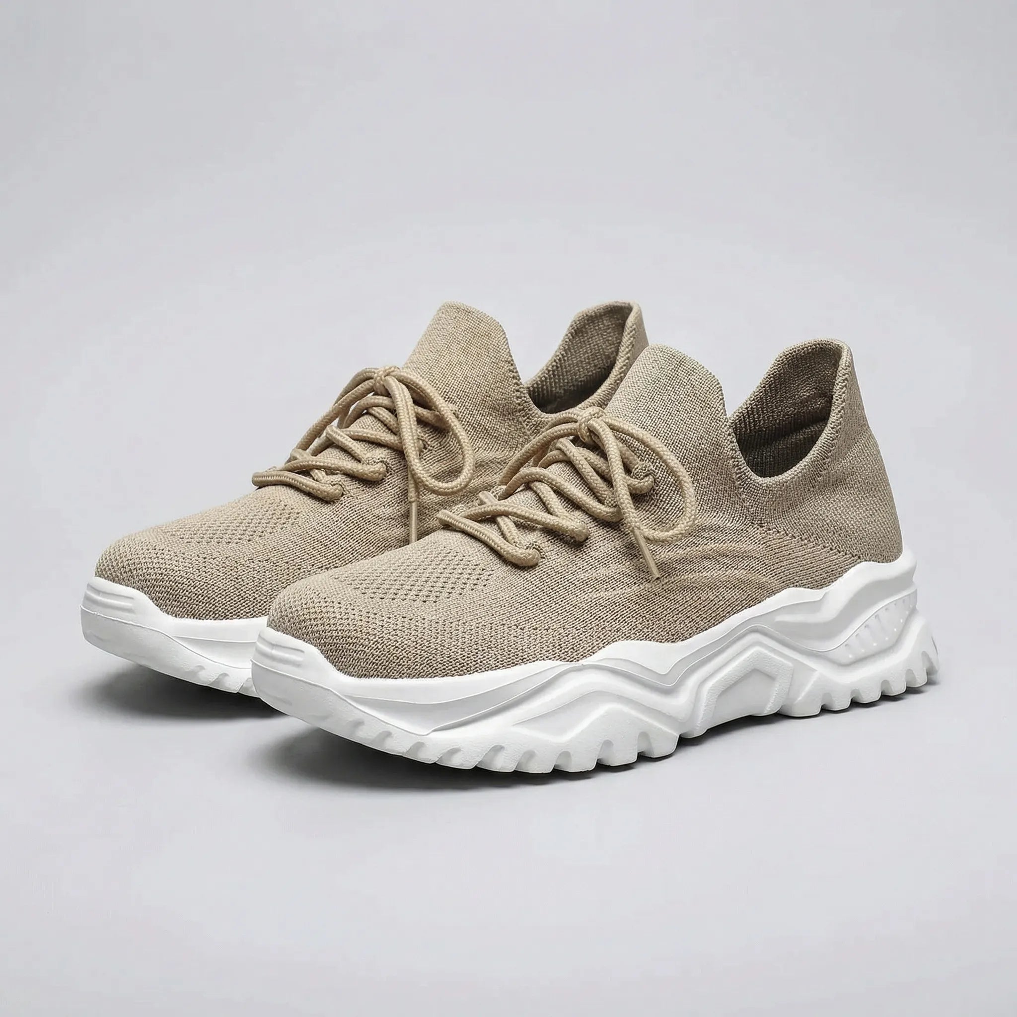 Beige sneakers with white soles on a gray background3
