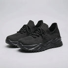 Black running shoes on a white background