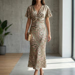 Women’s midi cocktail dress with V-neckline, knot-detail waist and flutter sleeves for weddings and summer occasions.
