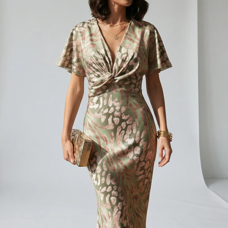 Women’s midi cocktail dress with V-neckline, knot-detail waist and flutter sleeves for weddings and summer occasions.1