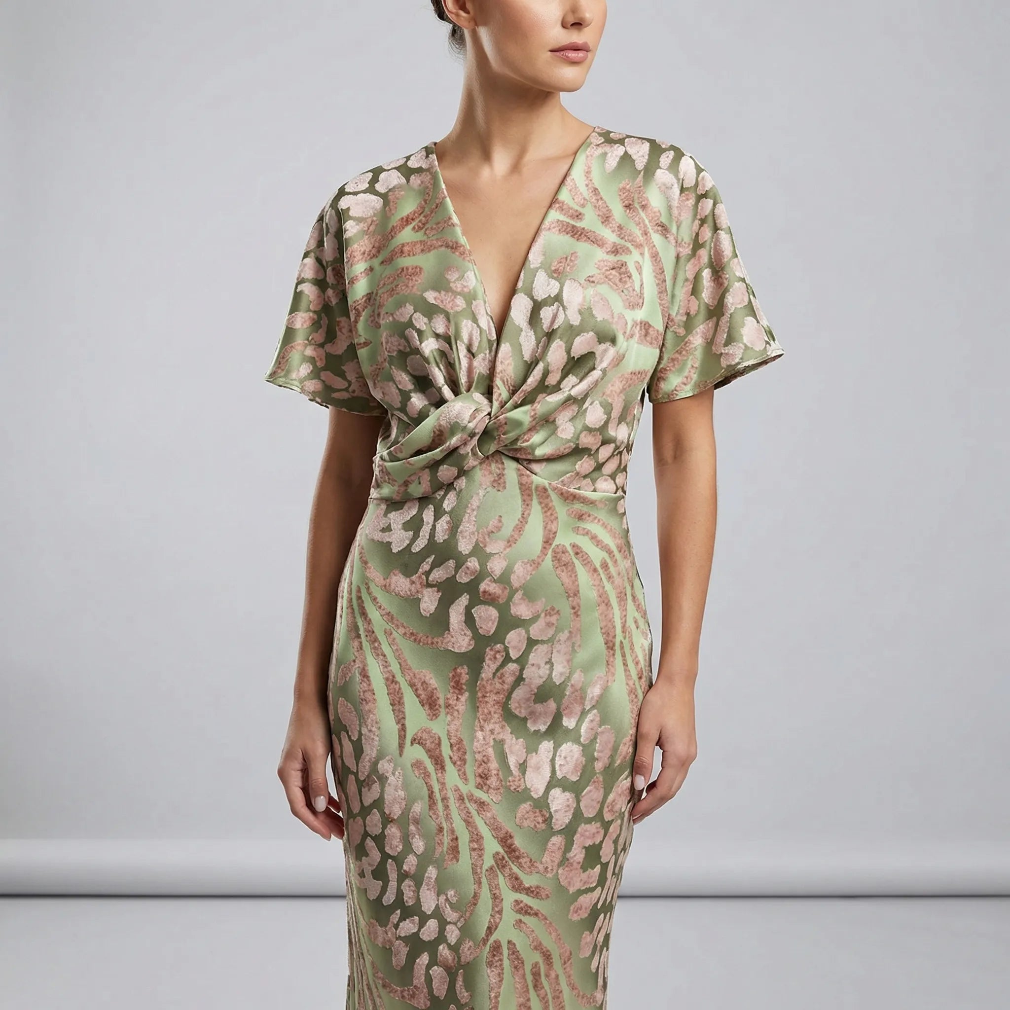 Women’s midi cocktail dress with V-neckline, knot-detail waist and flutter sleeves for weddings and summer occasions.3
