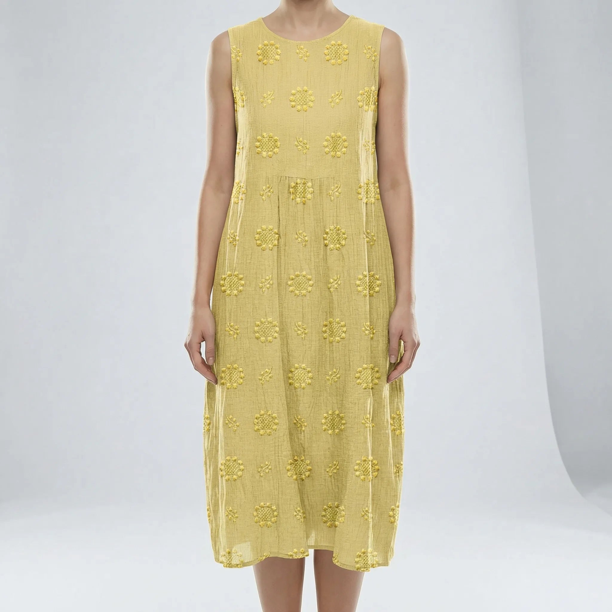 Light Yellow dress with floral patterns on a white background