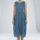 Blue sleeveless dress with floral patterns on a white background