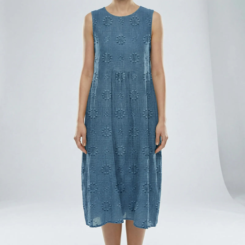 Blue sleeveless dress with floral patterns on a white background