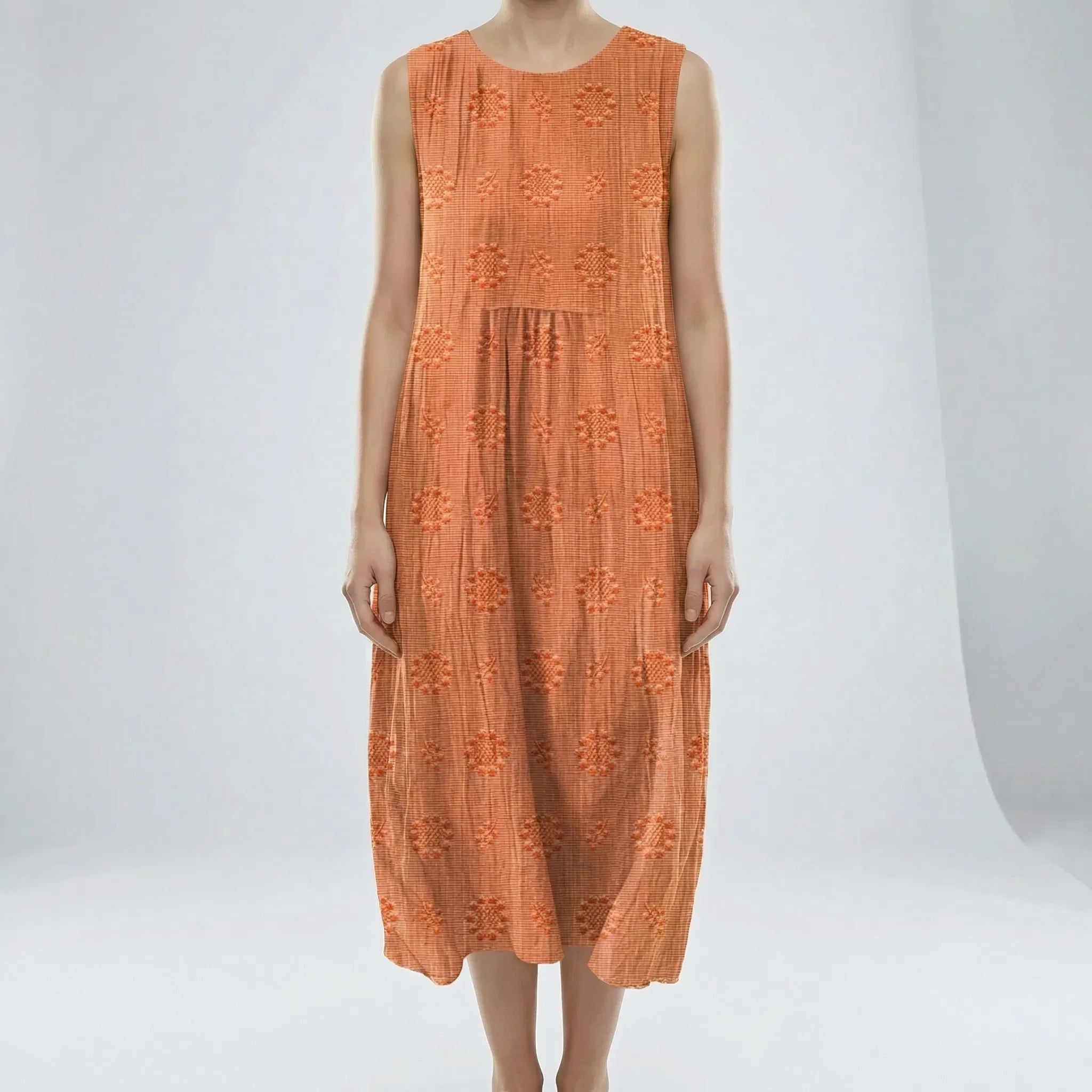 Orange dress with floral patterns on a white background