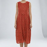 Red sleeveless dress with floral patterns on a white background