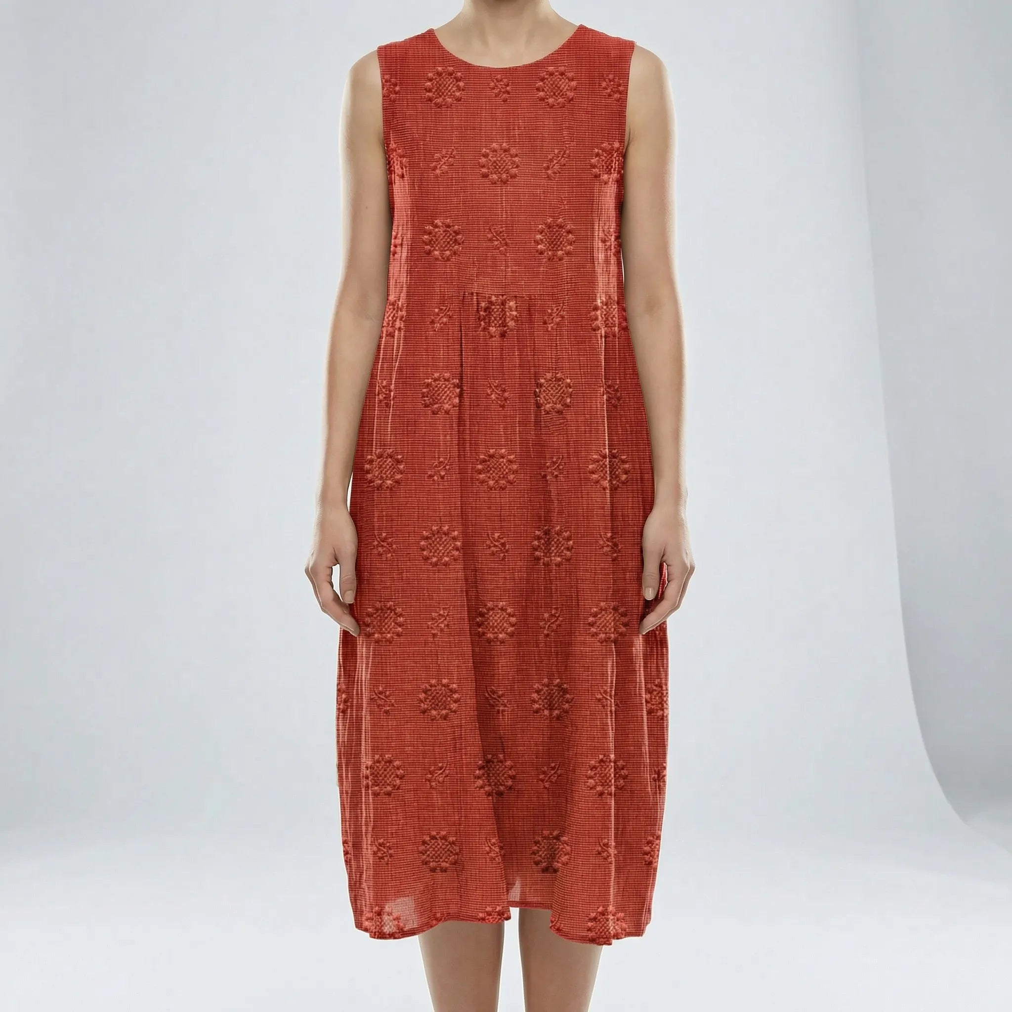 Red sleeveless dress with floral patterns on a white background