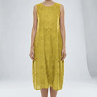 Yellow sleeveless dress with floral patterns on a white background