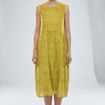 Yellow sleeveless dress with floral patterns on a white background