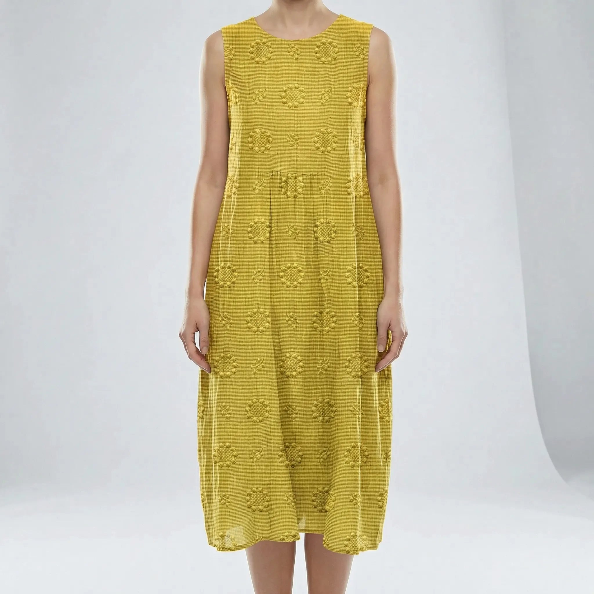 Yellow sleeveless dress with floral patterns on a white background