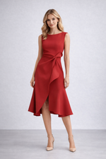 Woman wearing a red dress with a white background