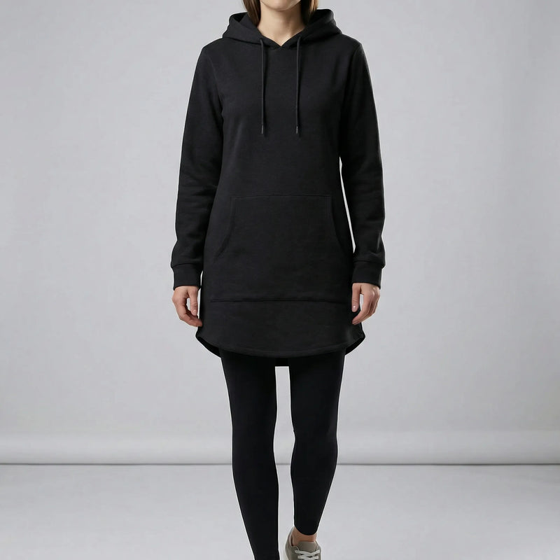 Person wearing a black hoodie and leggings on a plain background