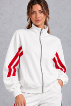 Women's white cropped track jacket – close-up of stand collar, front zip and striped sleeves