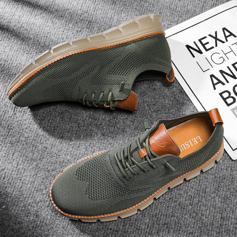 Green casual shoes with brown accents on a gray surface