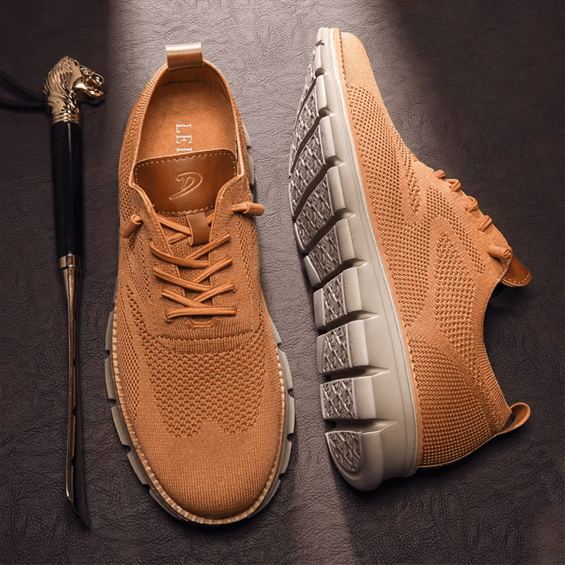 Brown sneakers with a walking cane on a dark surface