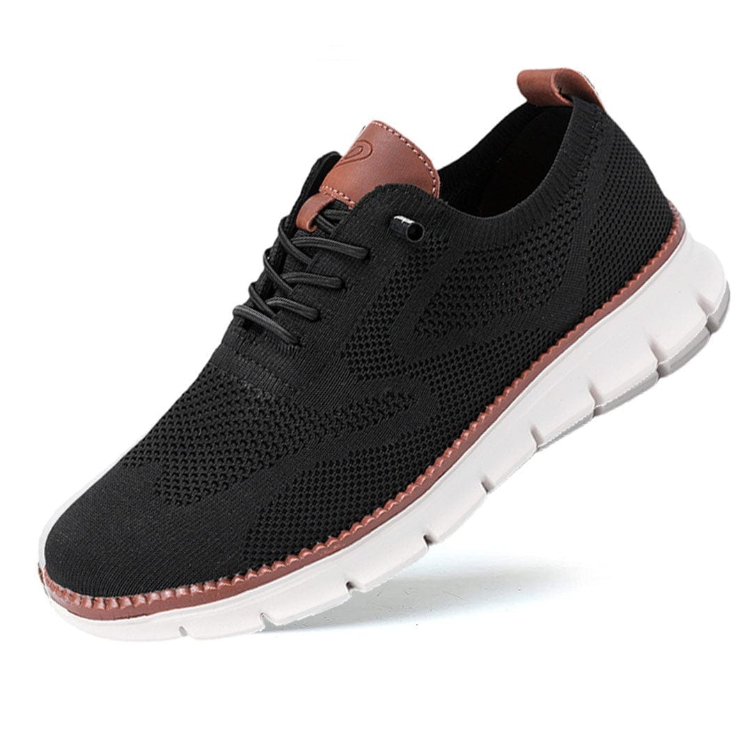 Black sneaker with brown accents on a white background