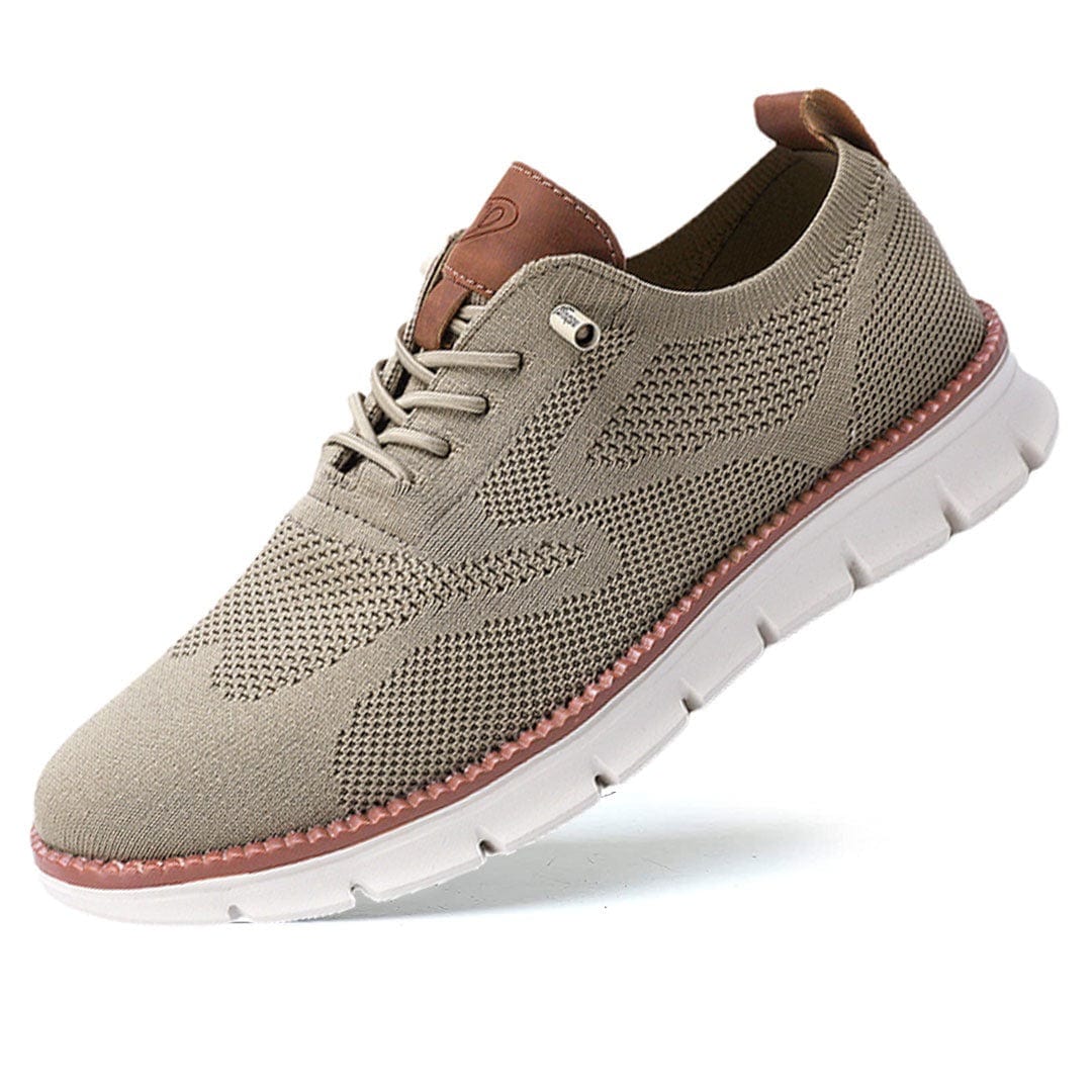 Beige sneaker with brown accents on a white background