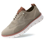 Beige sneaker with brown accents on a white background