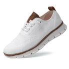White sneaker with brown accents on a white background