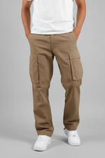 Beige cargo pants worn by a person on a white background