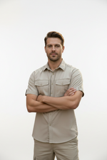 Beige short-sleeve shirt with pockets on a white background