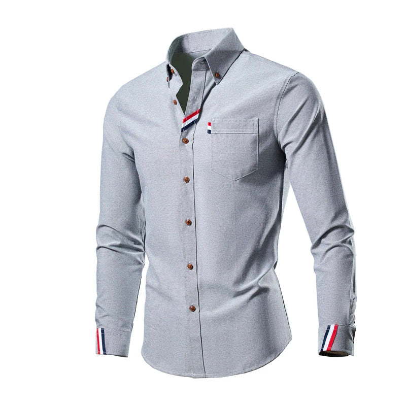 Gray button-up shirt with striped cuffs on a white background